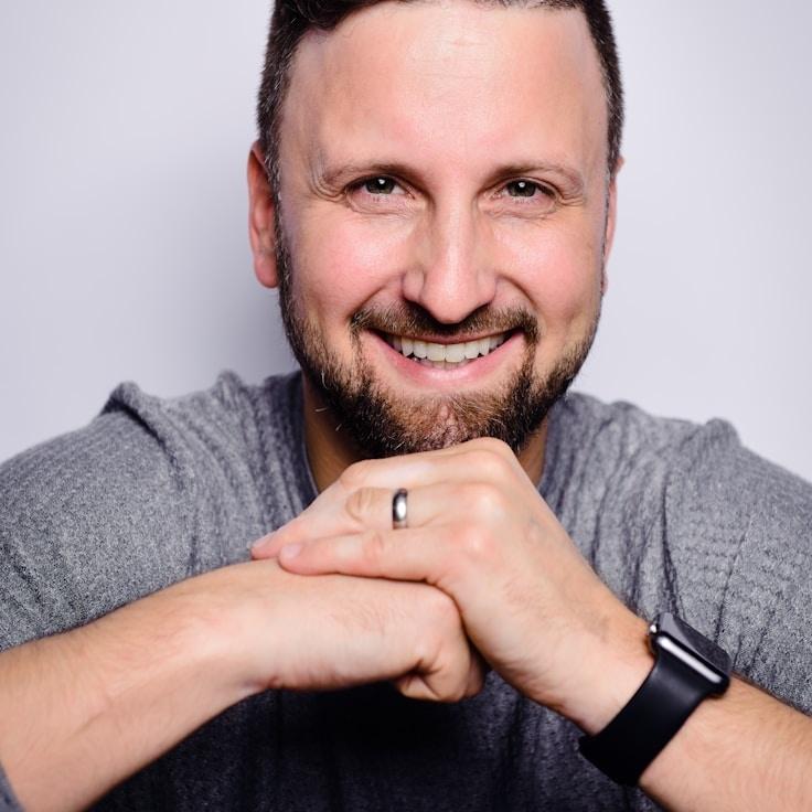 Avery Patel, Lead Design Curator at Simple Bridge Trace, reviewing corporate floral arrangements